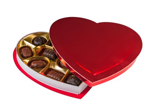 Assortment of chocolates in a heart shaped red box for a Valentine's day gift. Isolated on a white background with a clipping path