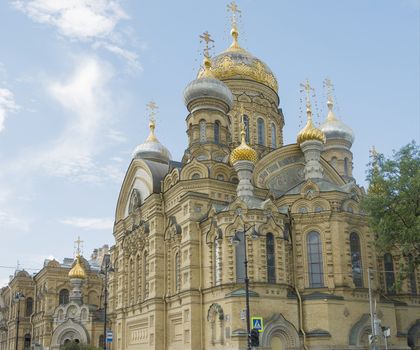 beautiful Christian church in St. Petersburg with golden domes and crosses