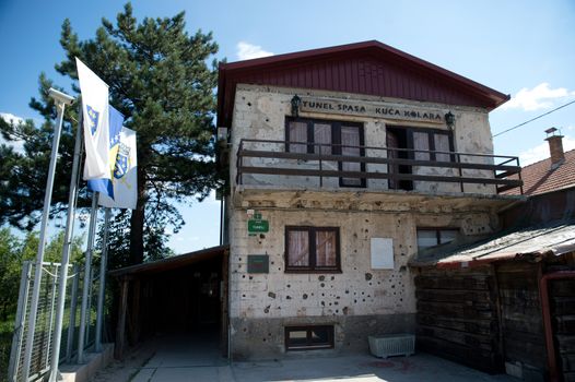 Sarajevo, Bosnia - July 7, 2016:The house through which Sarajevo Tunnel connected the city with other parts during the Siege of Sarajevo constructed in 1993. Note the bullet holes on walls.