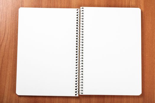open exercise book closeup on wooden background