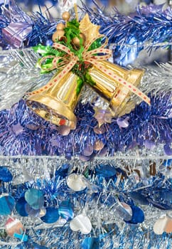 Christmas bells and tinsel for the holiday background