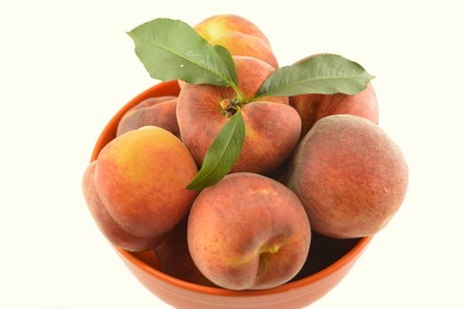 Bowl of delicious peaches