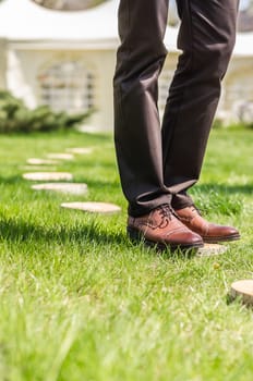 wedding decor section of tree trunk stumps on the green grass