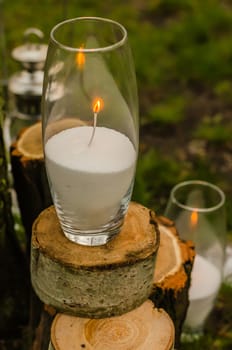 wedding decor, candles on the cut stumps