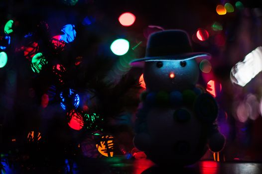 New year bokeh background with snowman