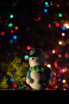 New year bokeh background with snowman