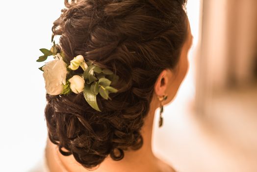 wedding bride hairstyle with a live flower