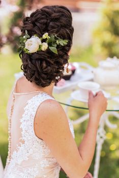 wedding bride hairstyle with a live flower