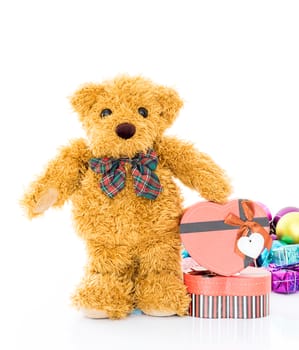 Teddy bear with 
Red heart shaped gift box on white background