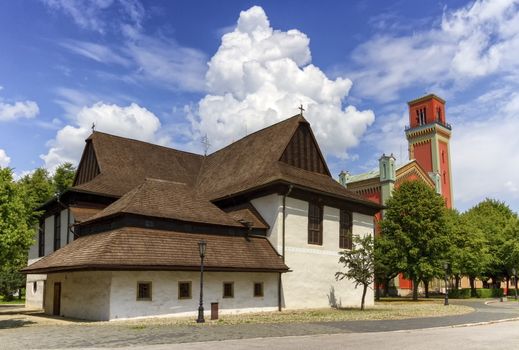 Wooden articular church in Kezmarok and lutheran tower by day, Slovakia