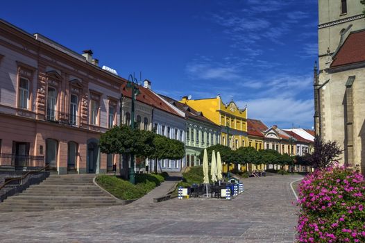 Historic houses and St. Nicolaus Church by day, Presov, Slovakia