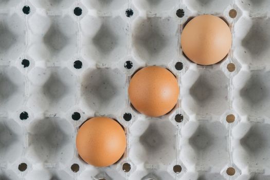 brown chicken eggs in cardboard