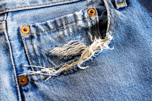 Grunge denim pocket closeup. texture background of jeans and pockets.