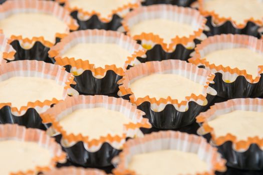 Preparations for baking cakes in molds on a baking sheet