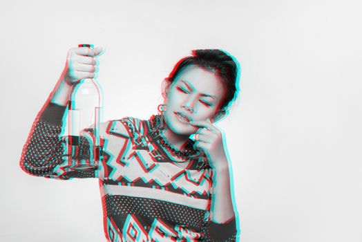 Asian woman holds up an empty bottle, mood wondering,blurred Image.