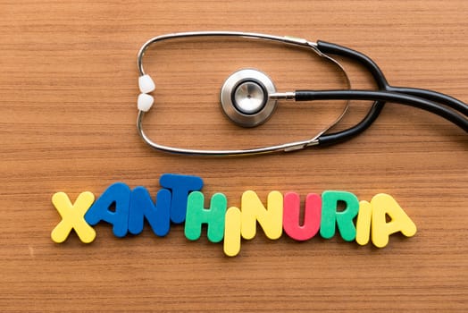 xanthinuria colorful word with stethoscope on wooden background