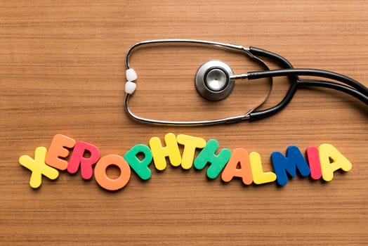 xerophthalmia colorful word with stethoscope on wooden background