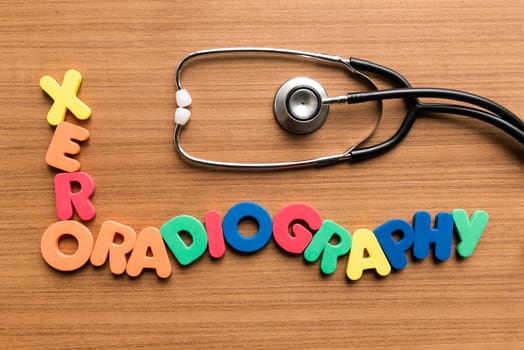 xeroradiography colorful word with stethoscope on wooden background
