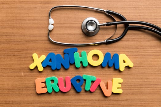 xanthoma eruptive colorful word with stethoscope on wooden background
