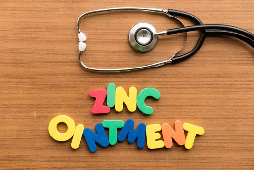 zinc ointment colorful word with stethoscope on wooden background