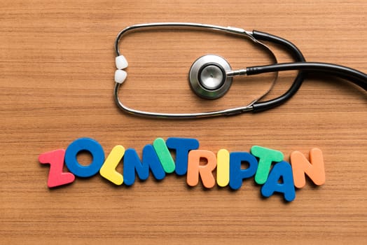 zolmitriptan colorful word with stethoscope on wooden background