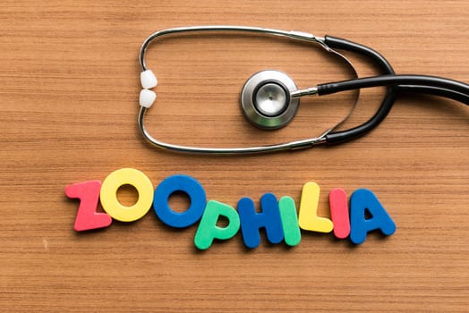 zoophilia colorful word with stethoscope on wooden background