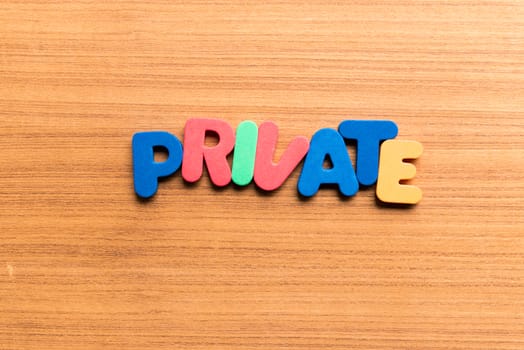 private colorful word on the wooden background