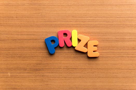 prize colorful word on the wooden background