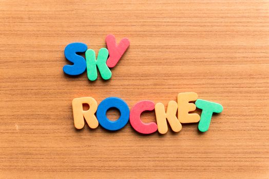 sky rocket colorful word on the wooden background