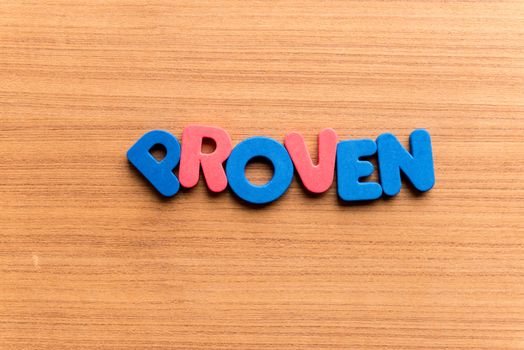 proven colorful word on the wooden background