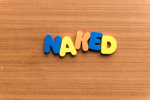 naked colorful word on the wooden background