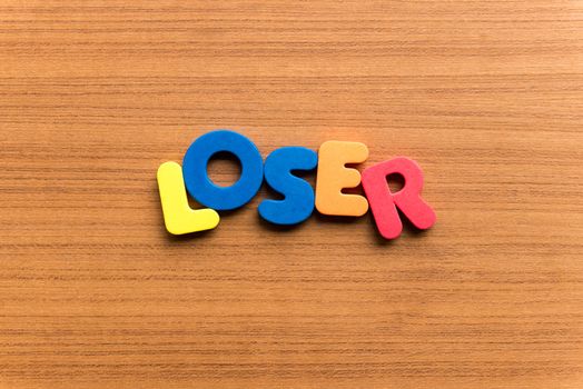 loser colorful word on the wooden background
