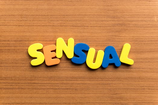 sensual colorful word on the wooden background