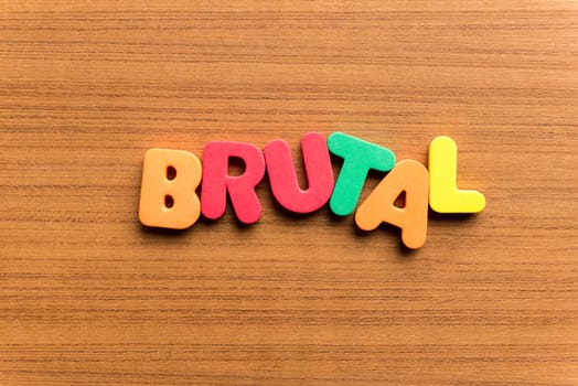 brutal colorful word on the wooden background