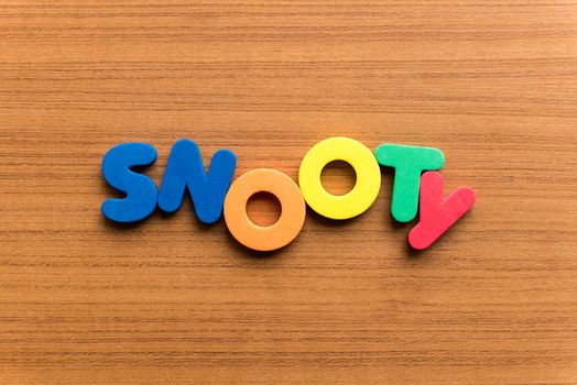 snooty colorful word on the wooden background