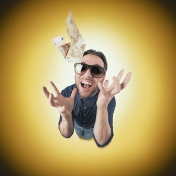 Funny man catch money from above screaming with sun glasses on circle background