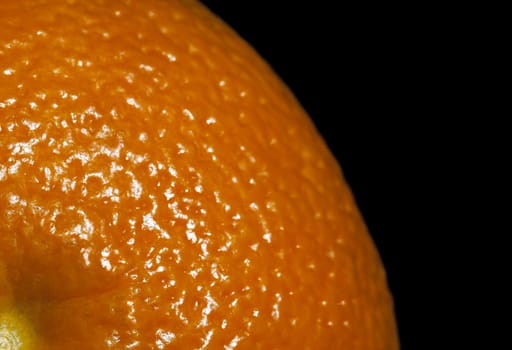 Close-up of an orange on black background