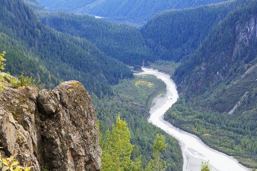 Horizontal view of winding Salmon River in British Columbia from glacier summit viewpoint on Granduc Mine Road. Location is north of Hyder, Alaska, USA, and Stewart, British Columbia on Canadian side of border.  Date taken is September, 2015.  