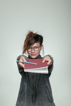 Asian women holding a book