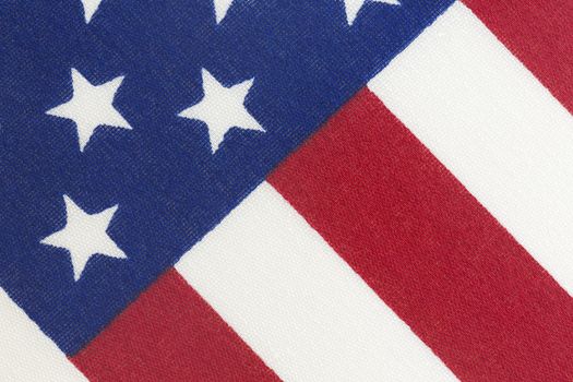 Background of American flag on diagonal and in close up photo.