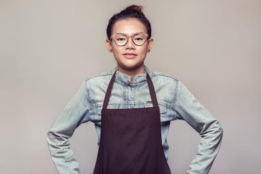 Asian woman standing with determination.