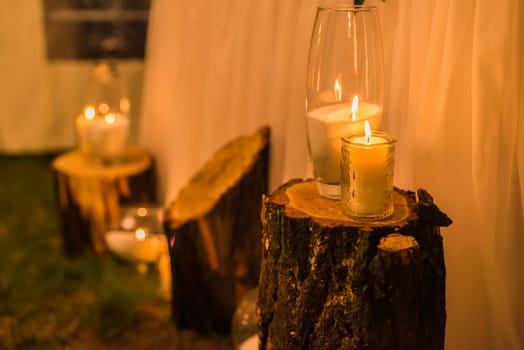 wedding decor, candles on the cut stumps