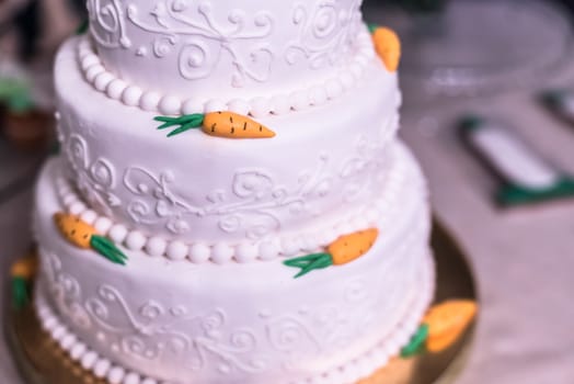 wedding cake with carrots in white glaze
