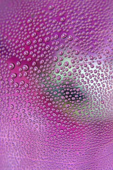 Abstract background. Drops of water on the crooked glass, shallow dof