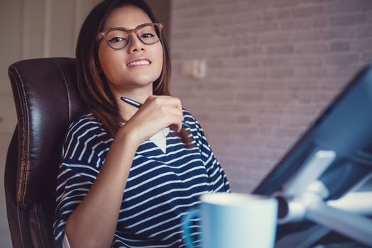 Photo of asian  women are using  electronic tools,focus on face