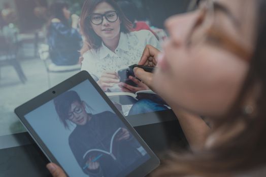 Photo of asia  women are using  electronic tools,focus on hand