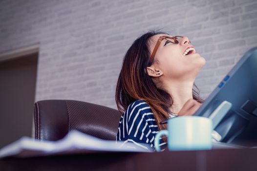 Photo of asian women are using electronic tools joyful mood,focus on face