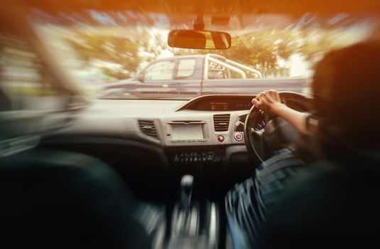 Photo Asian woman driving a car safely,blurred image