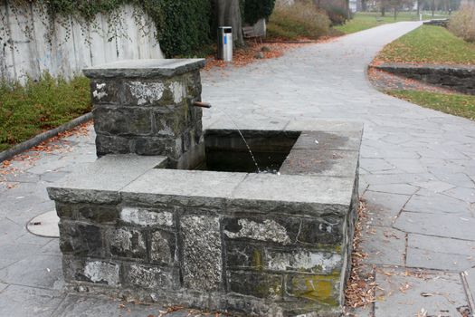 Erotic design fountain in the park, autumn, Lucerne, Switzerland