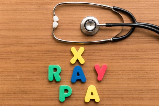 x ray pa colorful word with stethoscope on wooden background